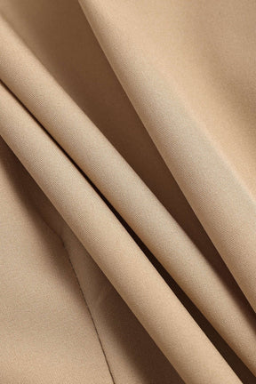 Chemisier beige vue de dos nuage