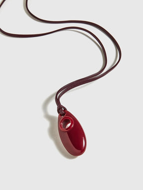 Collier pendentif rouge design soleil