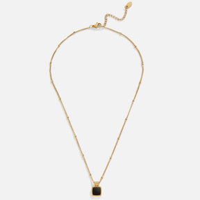 Pendentif carré noir et doré rayonnant