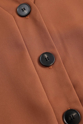 Combinaison marron à boutons vue de dos étoile