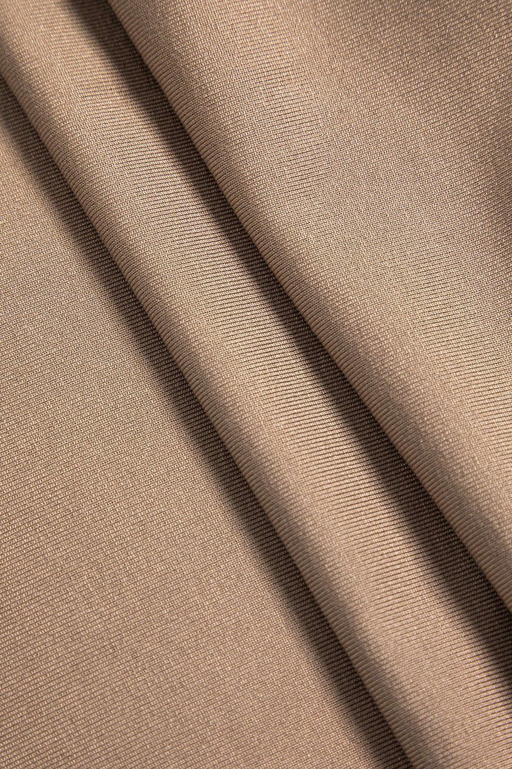 Combinaison chic beige détail manches raffinement