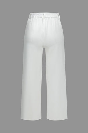 Ensemble pantalon et top blanc chic sérénité