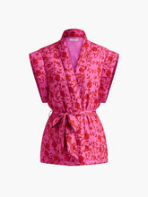 Gilet bohème rose à motifs floraux soleil