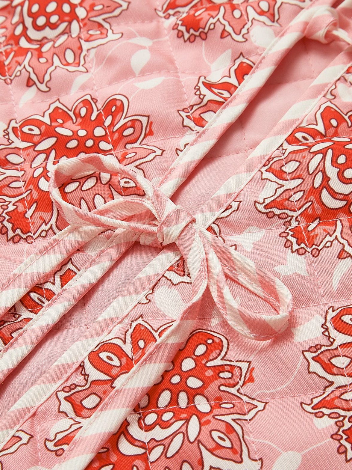 Gilet motifs fleurs détail grâce