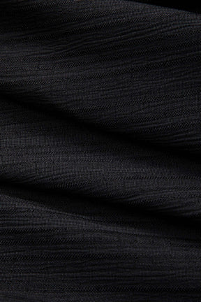 Jupe denim patchwork asymétrique détail finition cristal
