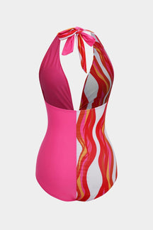 Maillot de bain rayé rose et blanc vue de dos vague