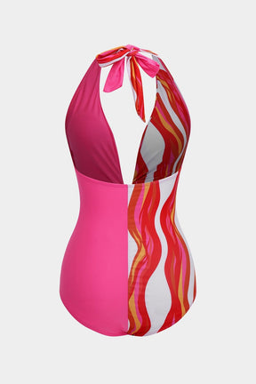 Maillot de bain rayé rose et blanc vue de dos vague