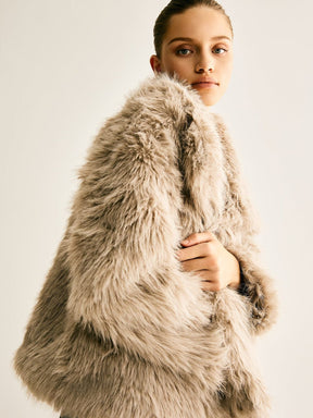 Manteau court fausse fourrure luxueux