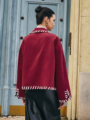 Manteau bordeaux détail finition grâce