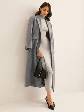 Manteau long gris vue profil grâce