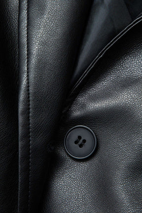 Détail ceinture manteau similicuir noir douceur