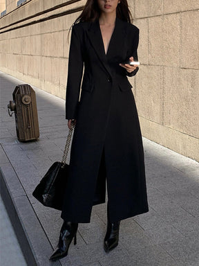 Manteau long noir élégant vue de dos étoile
