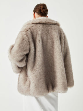 Manteau fausse fourrure coupe ample sophistiqué