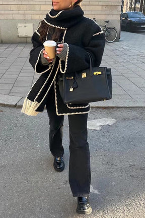 Manteau tweed noir avec bordures contrastées douceur