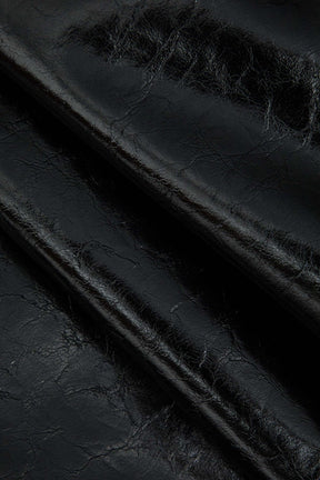 Mini-jupe noire simili cuir détail boutons cristal