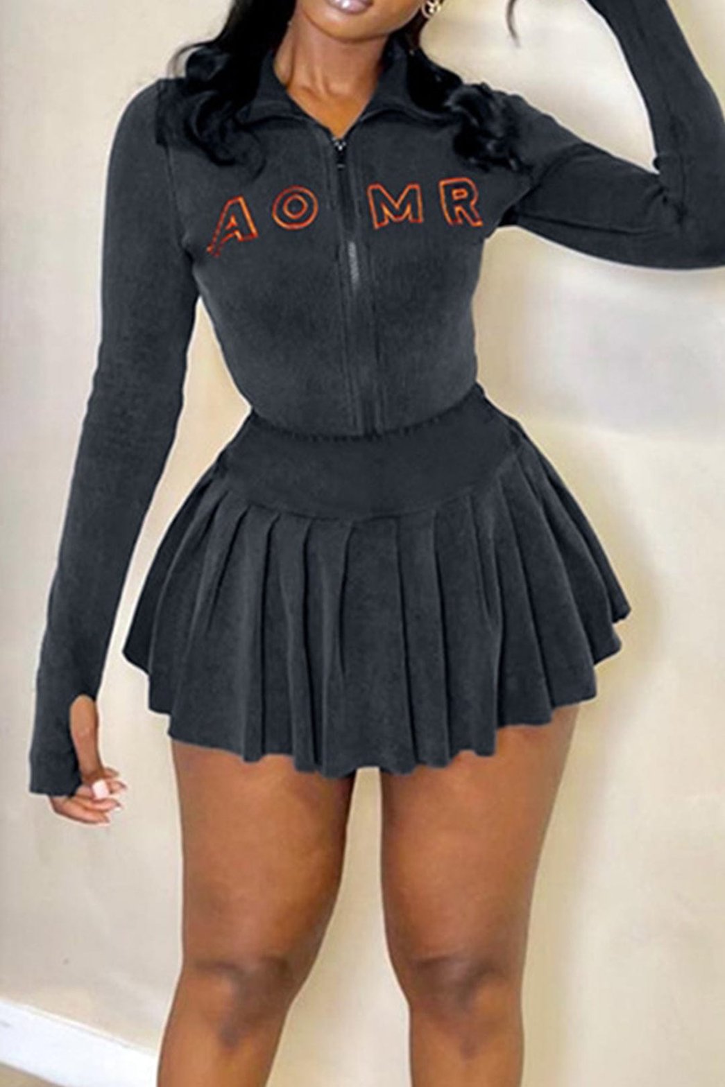Mini-jupe zippée noire plissée velours