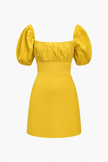 Robe mini drapée jaune vue de face soleil
