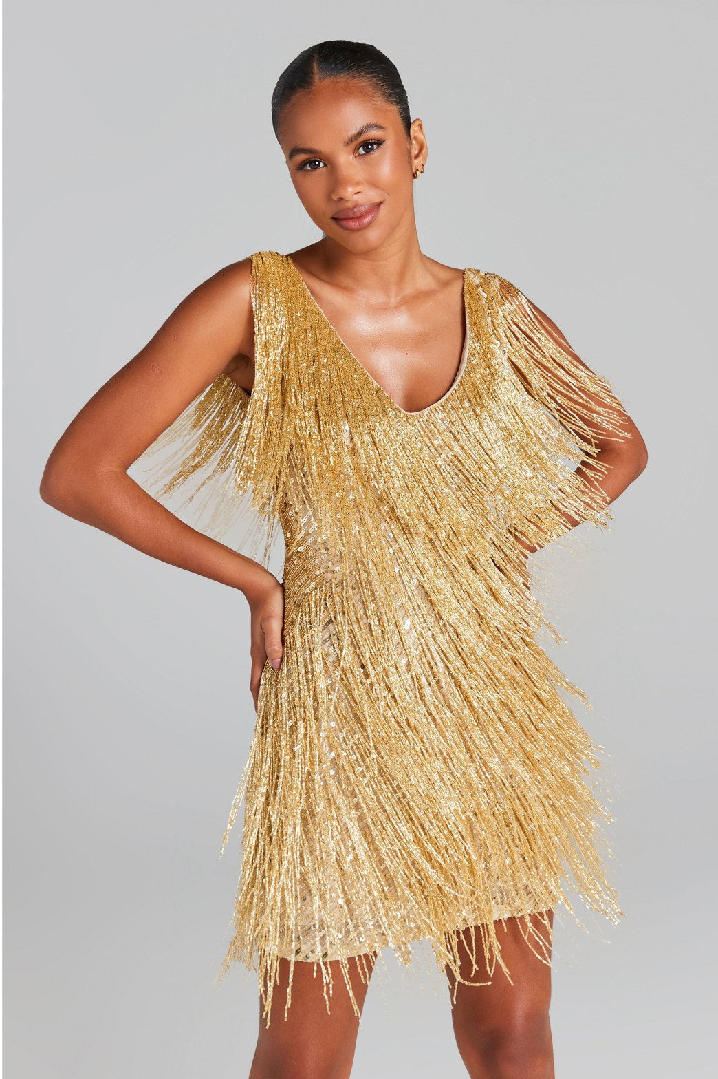 Robe dorée à franges scintillantes étoile