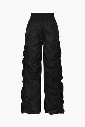 Pantalon cargo noir drapé élégant soleil