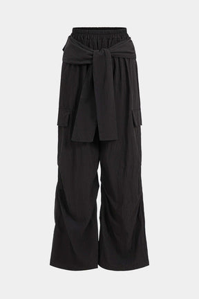 Pantalon large noir avec ceinture nouée élégant soleil