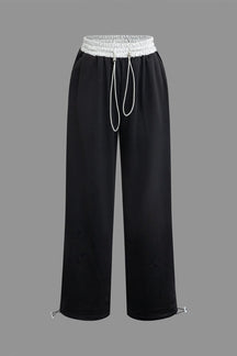 Pantalon noir large à cordon blanc élégant soleil