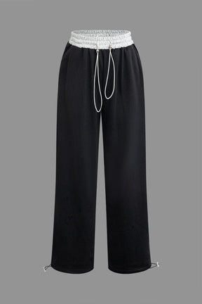 Pantalon noir large à cordon blanc élégant soleil