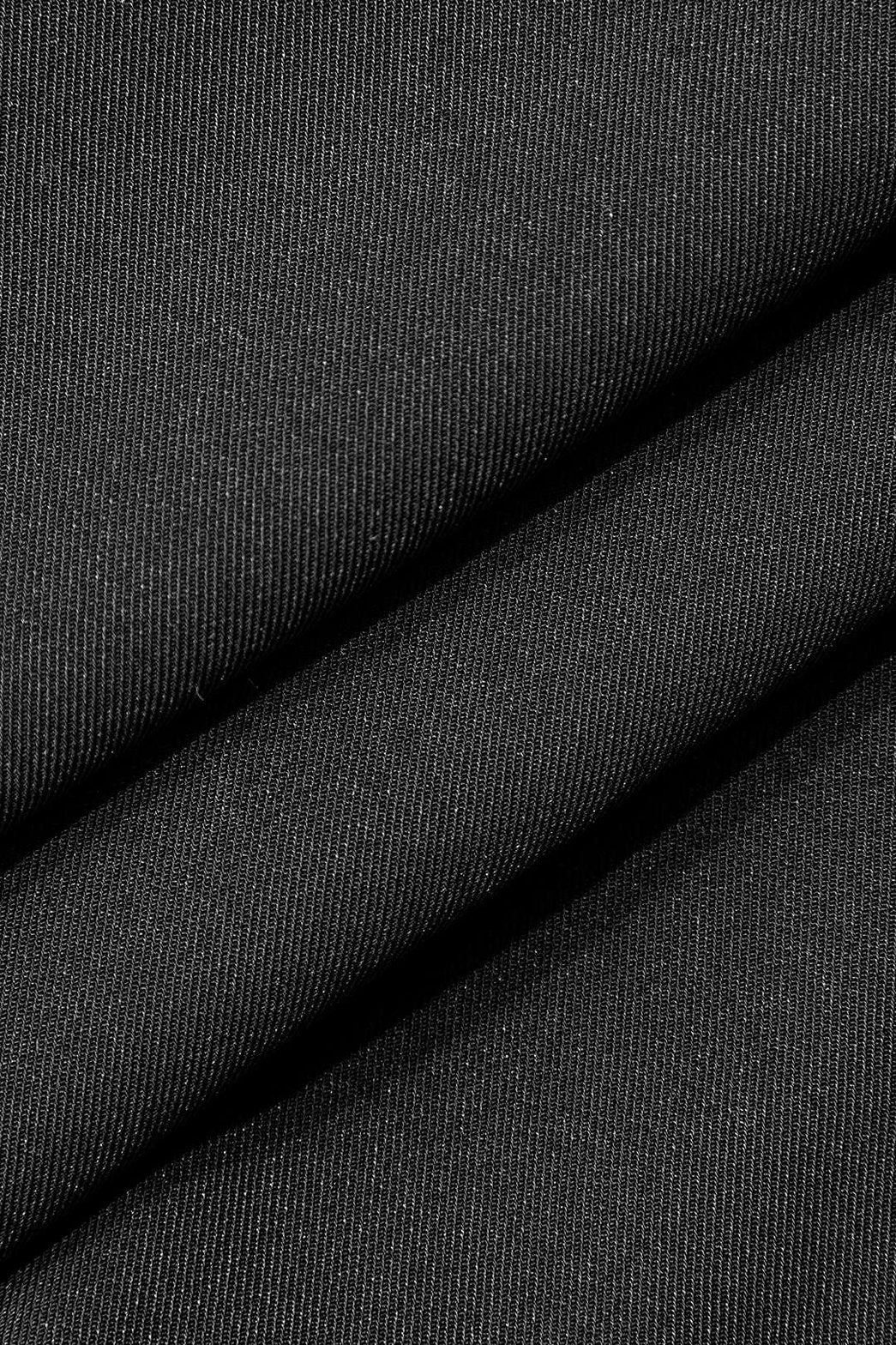 Détail de la boucle sur pantalon large noir étoile