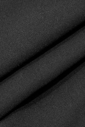 Détail de la boucle sur pantalon large noir étoile