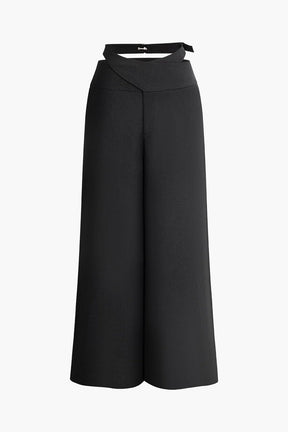 Pantalon large noir élégant avec boucle décorative soleil