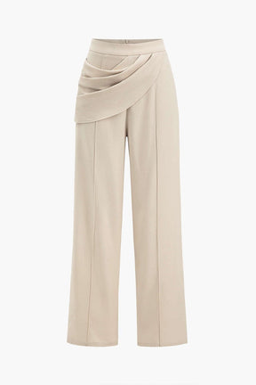 Pantalon drapé beige élégant lumière