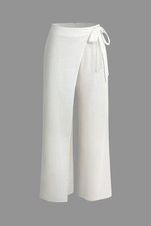 Pantalon large blanc en lin avec nœud décoratif soleil