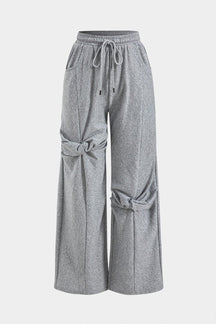 Pantalon large gris avec nœuds décoratifs serein
