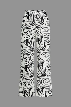 Pantalon large marbré noir et blanc vue face soleil