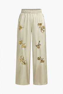 Pantalon large pailleté beige élégant papillon