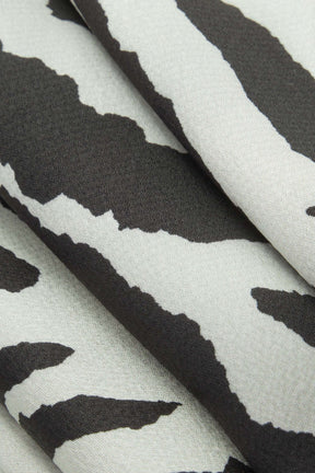 Pantalon palazzo imprimé zébré vue ensemble arc