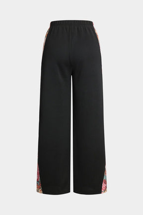 Pantalon palazzo noir à motifs floraux vue côté lune