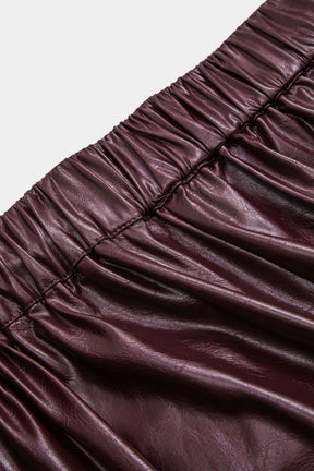 Pantalon similicuir bordeaux détail bouton pluie