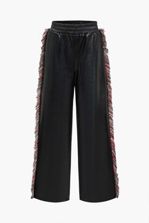 Pantalon noir en simili cuir à franges latérales étoile