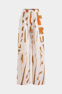 Pantalon large imprimé abstrait beige et orange soleil