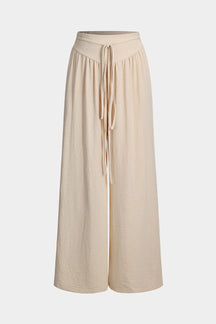 Pantalon palazzo beige fluide vue de face soleil