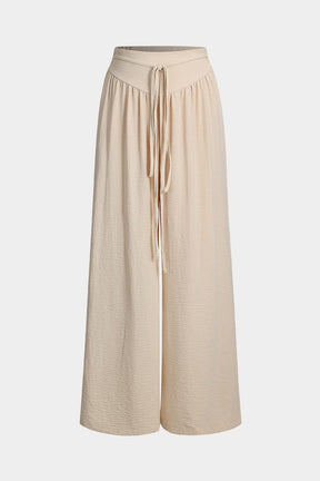 Pantalon palazzo beige fluide vue de face soleil