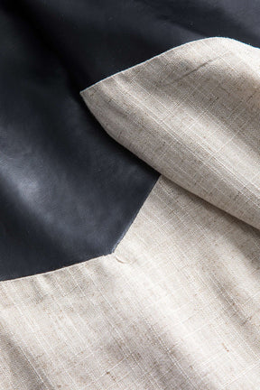 Pantalon bimatière noir et beige vue trois-quarts pluie