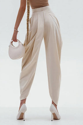 Pantalon plissé élégant crème soie