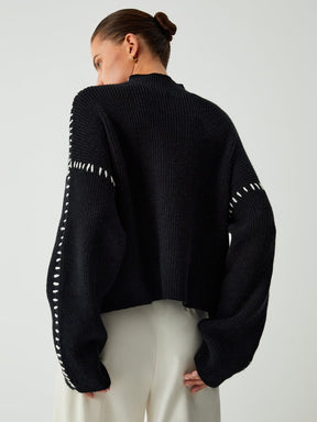 Pull col roulé vue latérale élégance
