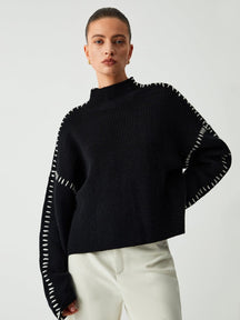 Pull col roulé noir élégant douceur