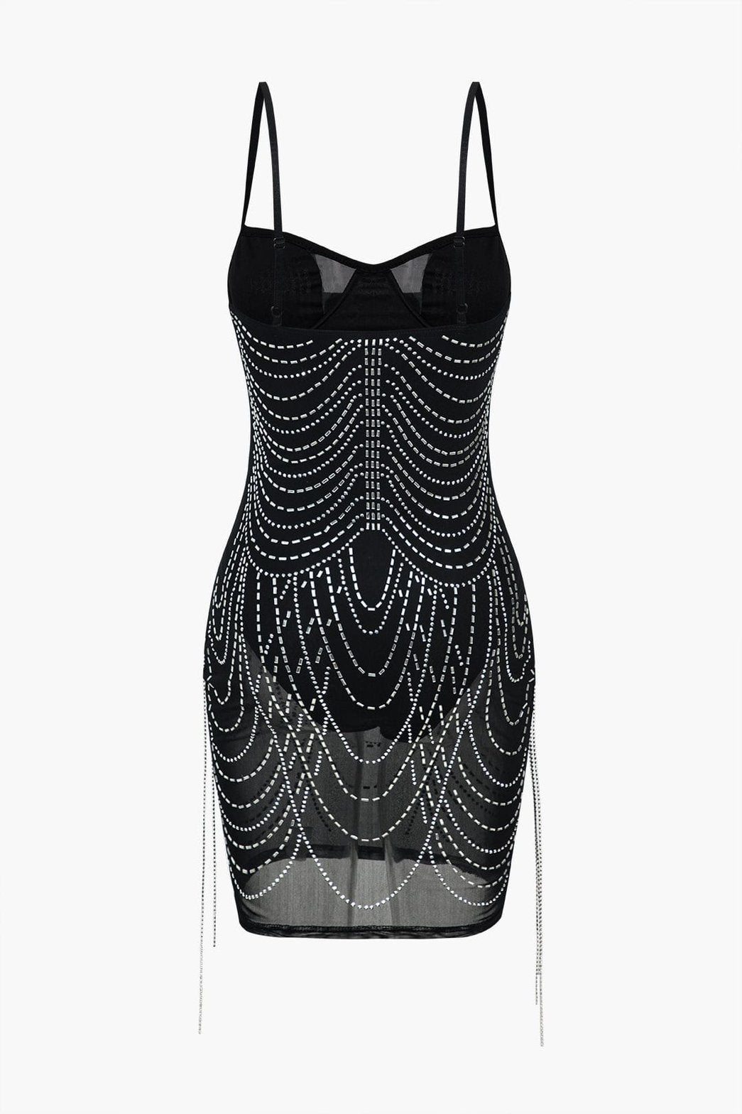 Détail des franges scintillantes sur robe noire velours