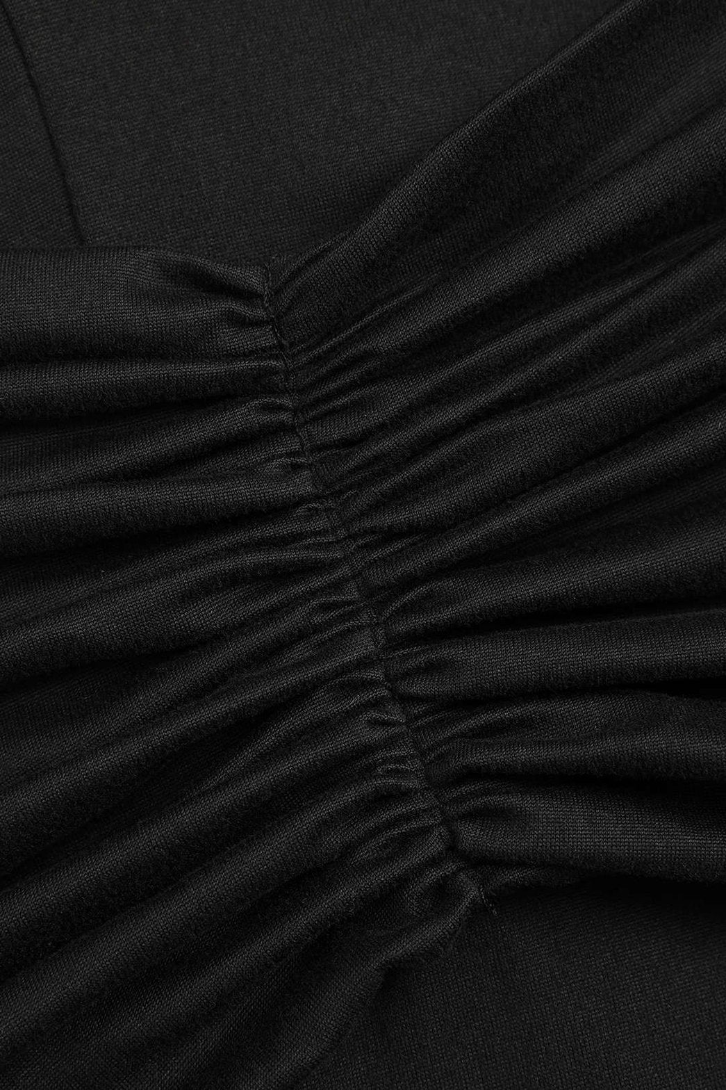 Détail nœud robe longue noire - Élégance