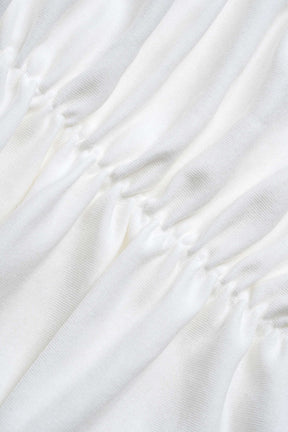 Robe longue blanche drapée raffinement