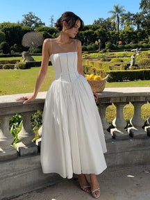 Robe midi élégante blanche soleil
