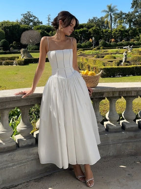 Robe midi élégante blanche soleil